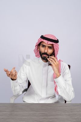 Gulf man talking on the phone