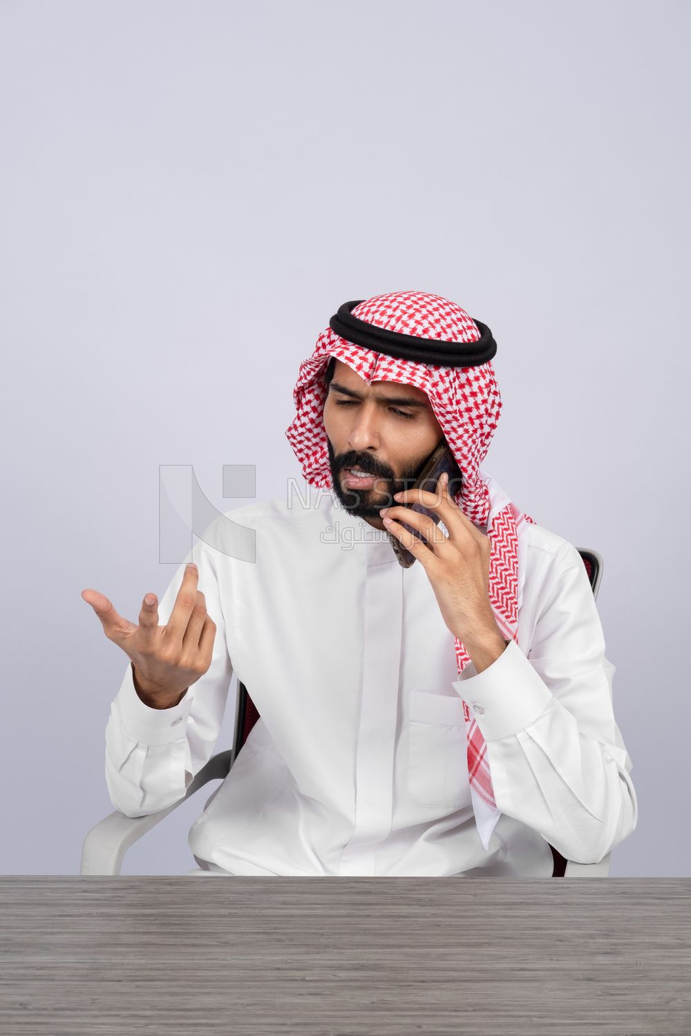 Gulf man talking on the phone
