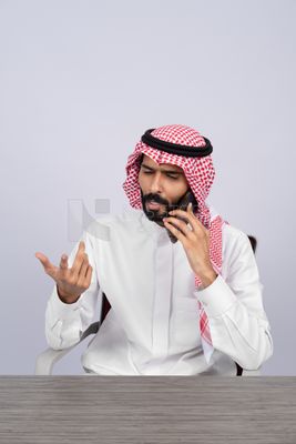 Gulf man talking on the phone