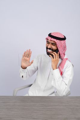 Gulf man talking on the phone happily