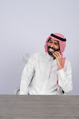 Gulf man talking on the phone happily