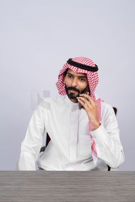 Gulf man talking on the phone