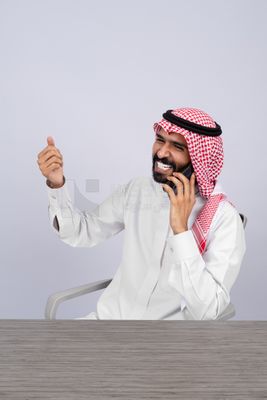 Gulf man talking on the phone happily