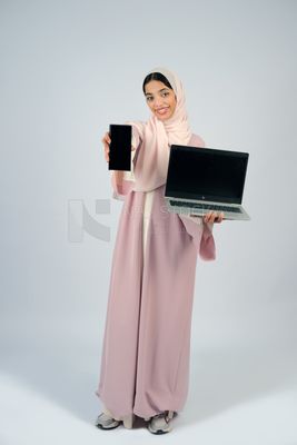 Gulf girl holding a laptop with a phone