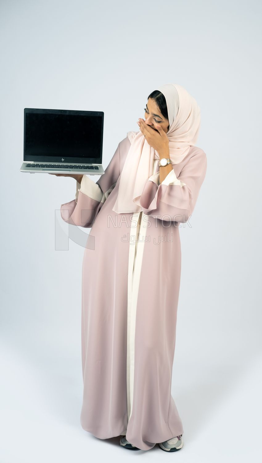 Gulf girl holding a laptop