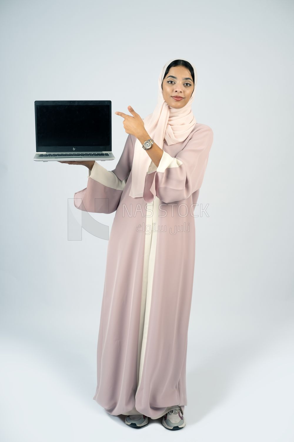 Gulf girl holding a laptop