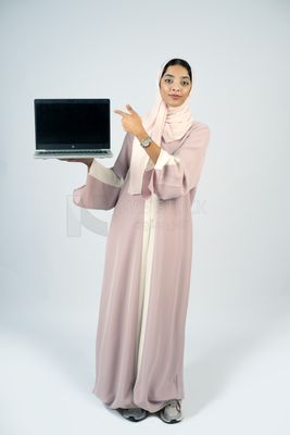 Gulf girl holding a laptop