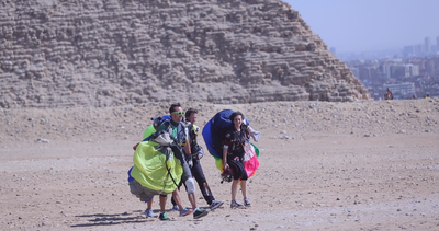 group of tourists after landing from a skydive, skydiving