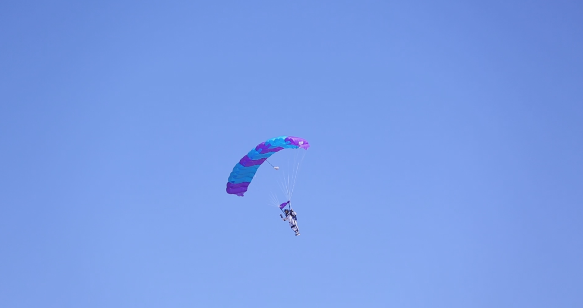 Person riding on a parachute