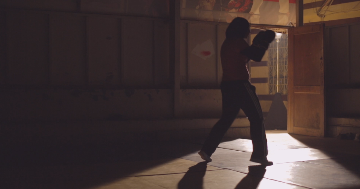 Veiled girl training in boxing, bodybuilding, violent sports and self-defense, wrestling and sports