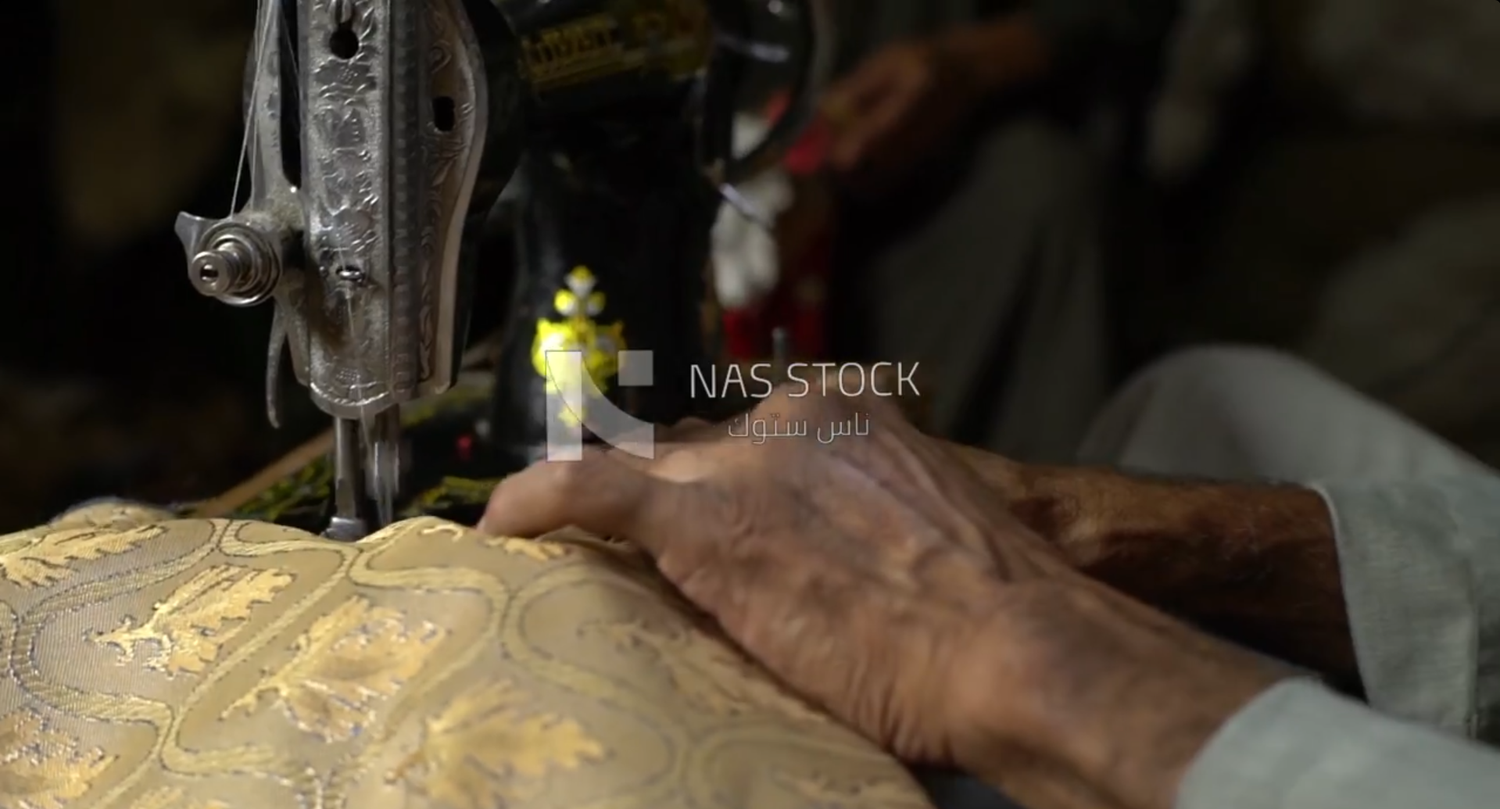 Man working on a sewing machine