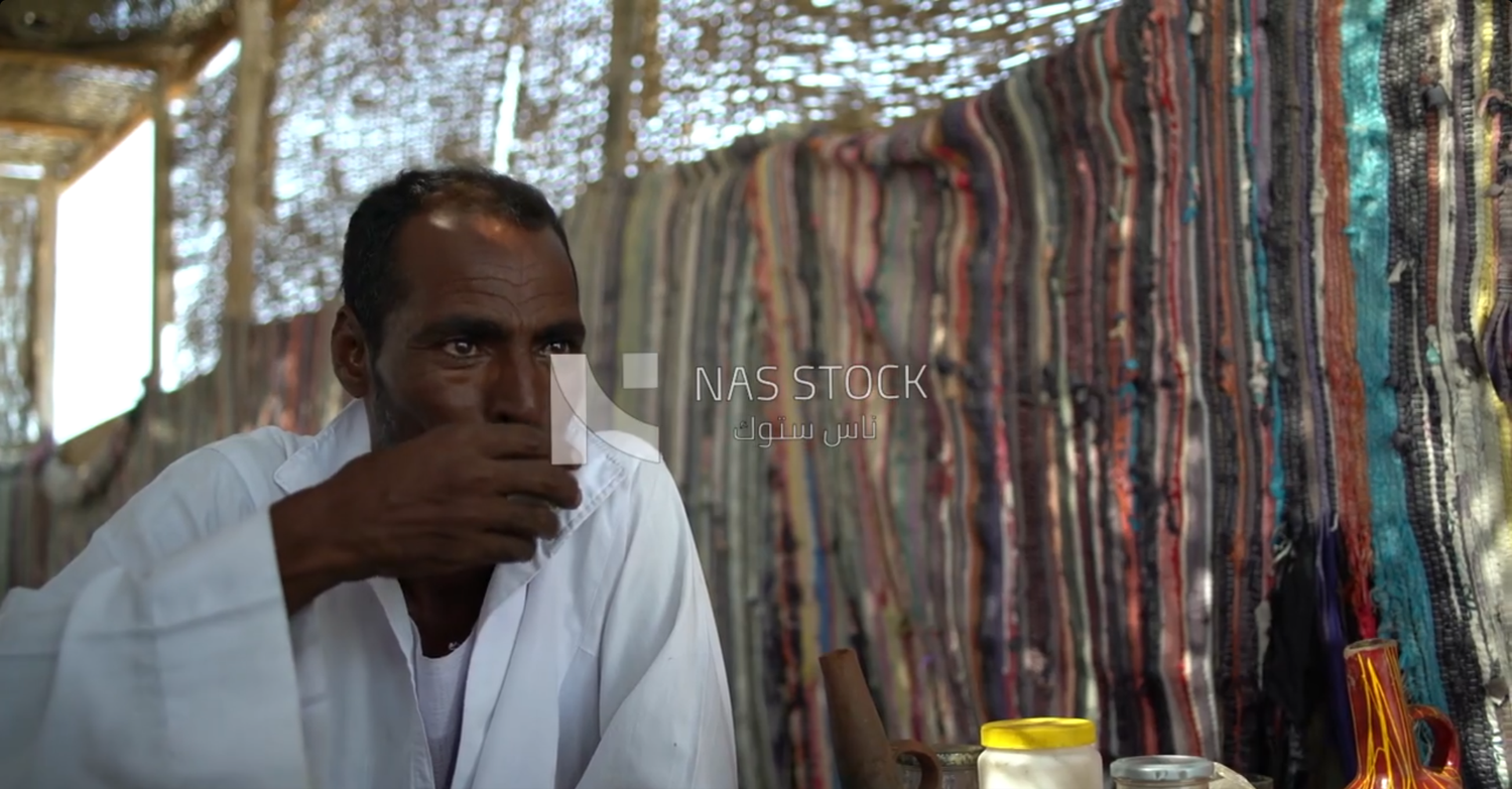 Man giving one a cup of tea and drinking with each other the tea