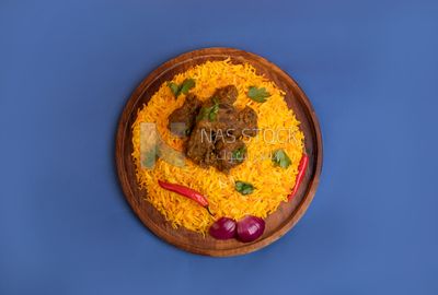Wooden plate of delicious biryani rice with meat,  traditional Arabic dishes, Arabic food, popular dishes, delicious recipes and dishes, delicious food