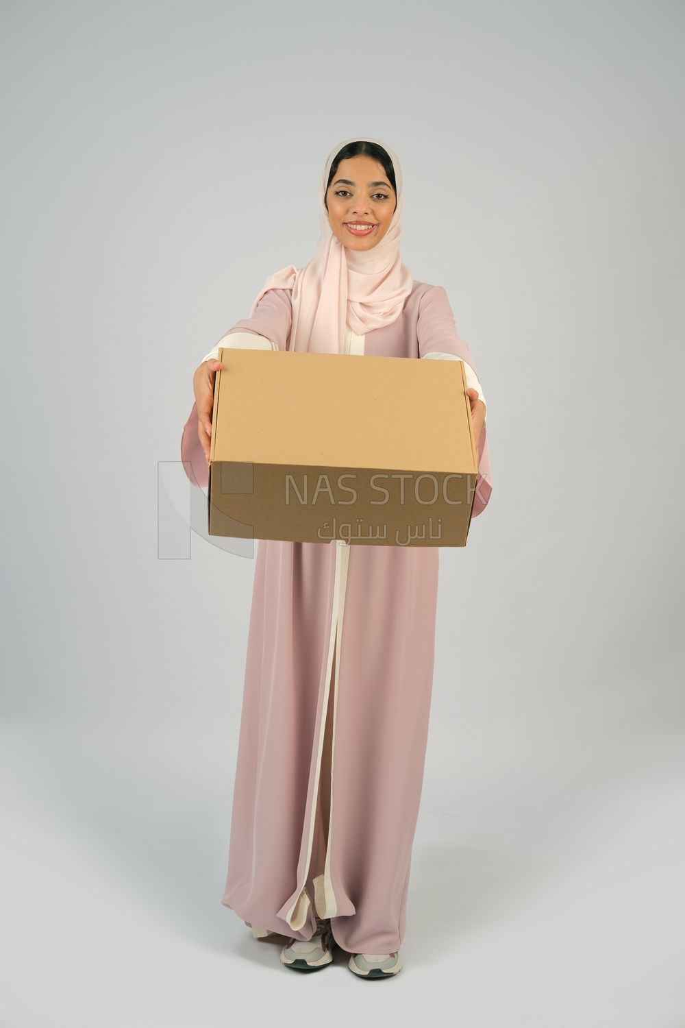 Gulf girl carrying order shipping box