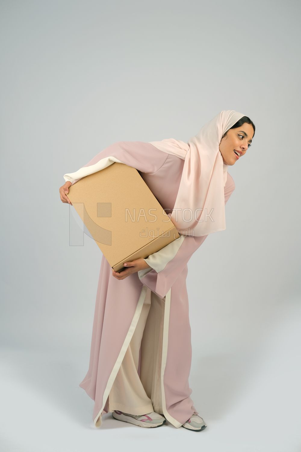 Gulf girl carrying order shipping box