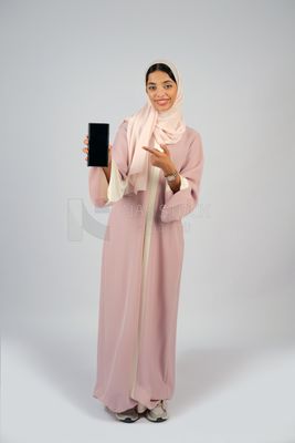 Gulf girl holding a mobile phone with a blank black screen