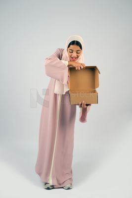 Gulf girl carrying order shipping box