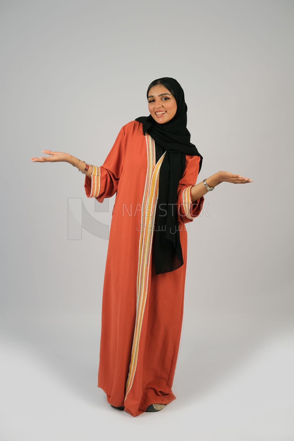 Gulf girl in colorful abaya and black hijab