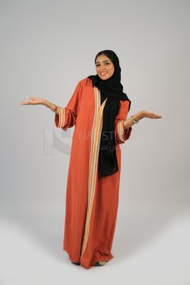 Gulf girl in colorful abaya and black hijab