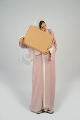 Gulf girl carrying order shipping box