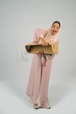 Gulf girl carrying order shipping box
