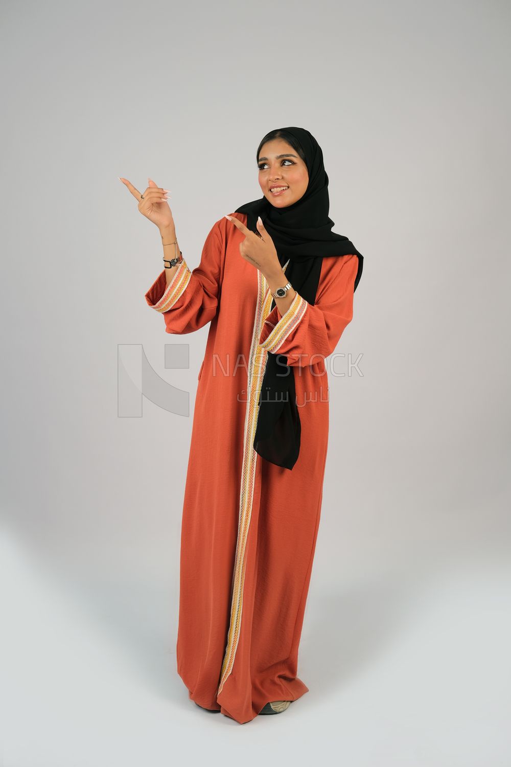 Gulf girl in colorful abaya and black hijab