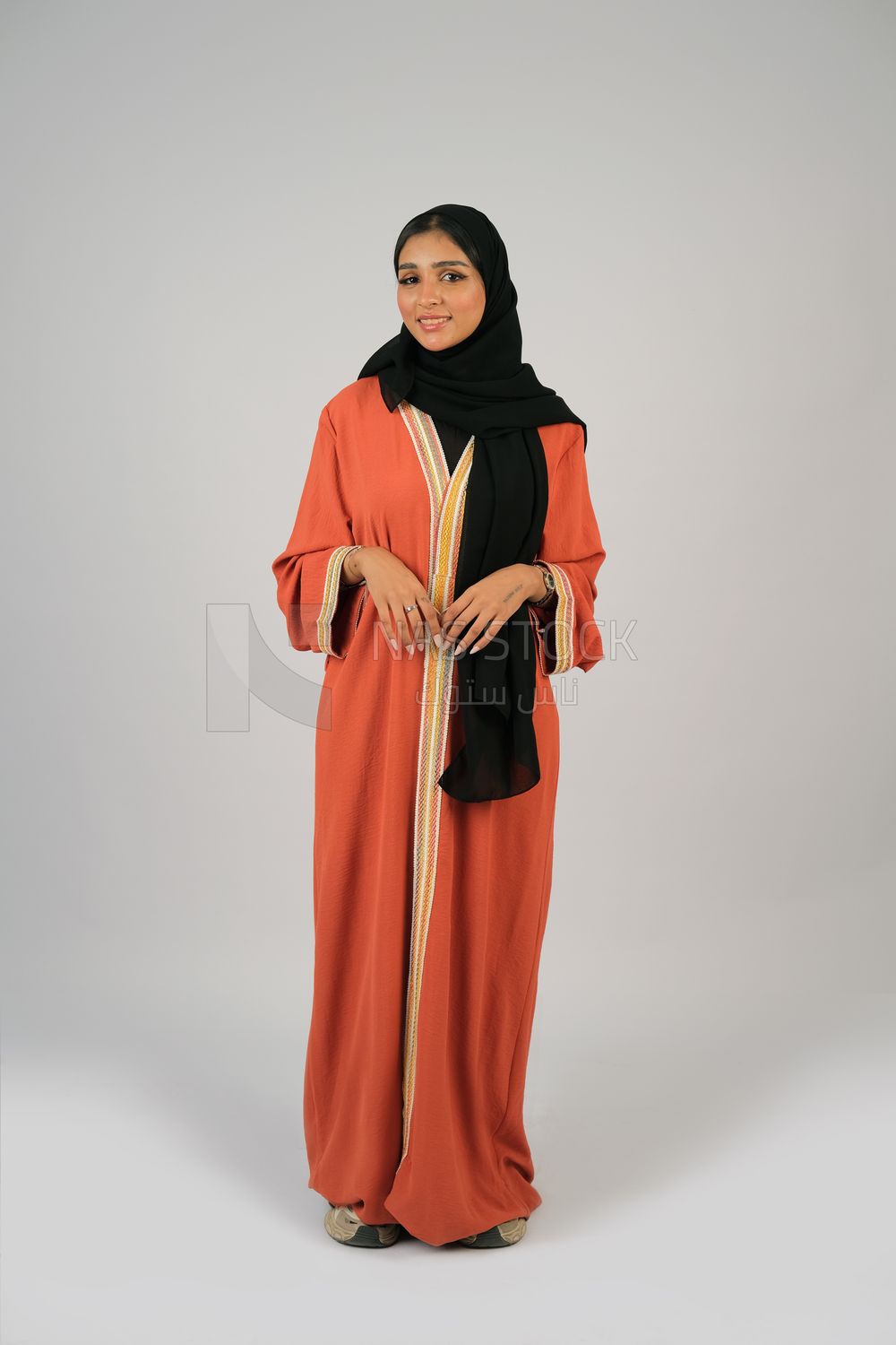 Gulf girl in colorful abaya and black hijab