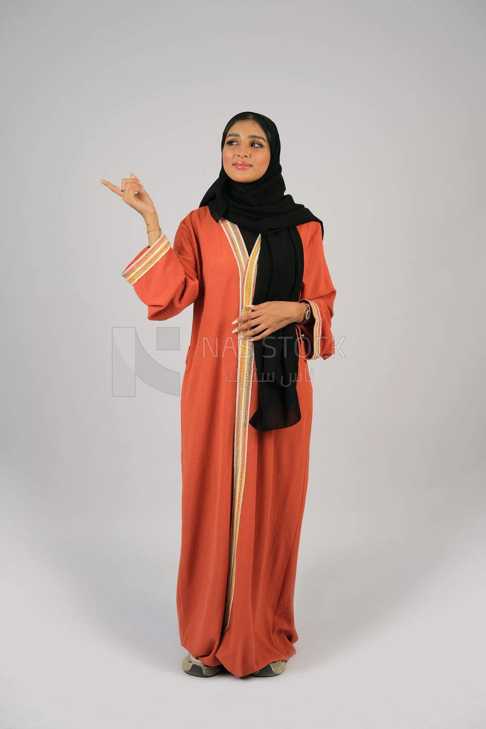 Gulf girl in colorful abaya and black hijab