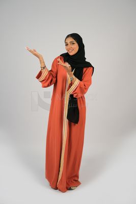 Gulf girl in colorful abaya and black hijab