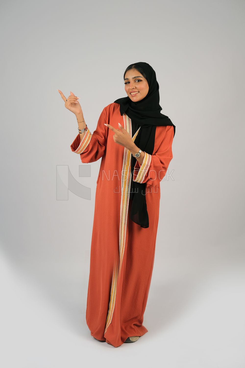 Gulf girl in colorful abaya and black hijab