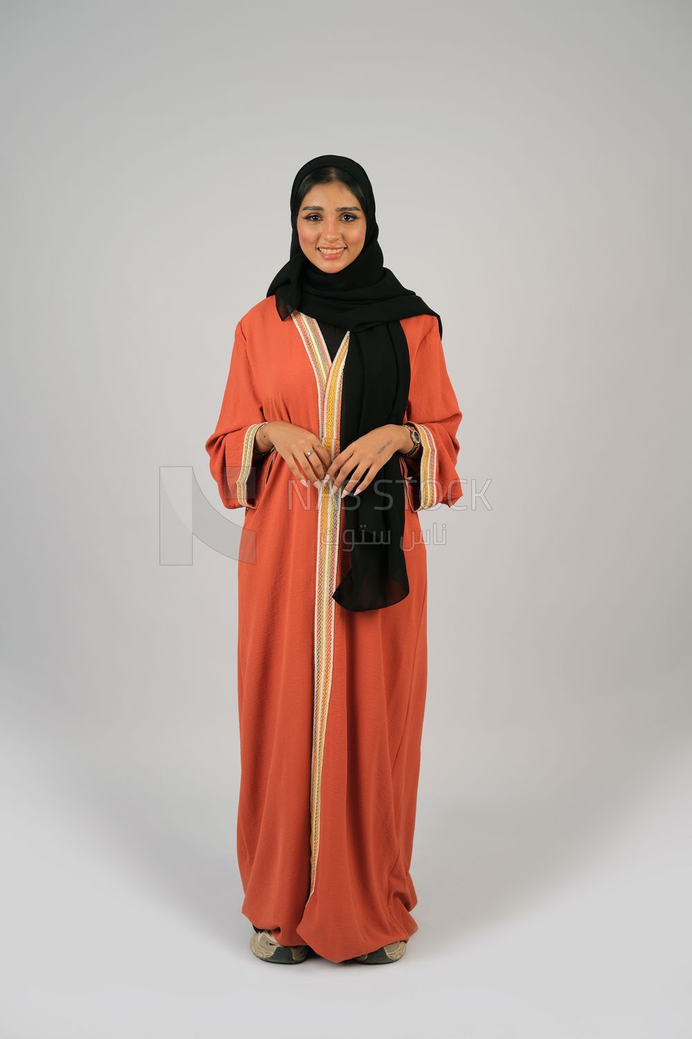 Gulf girl in colorful abaya and black hijab