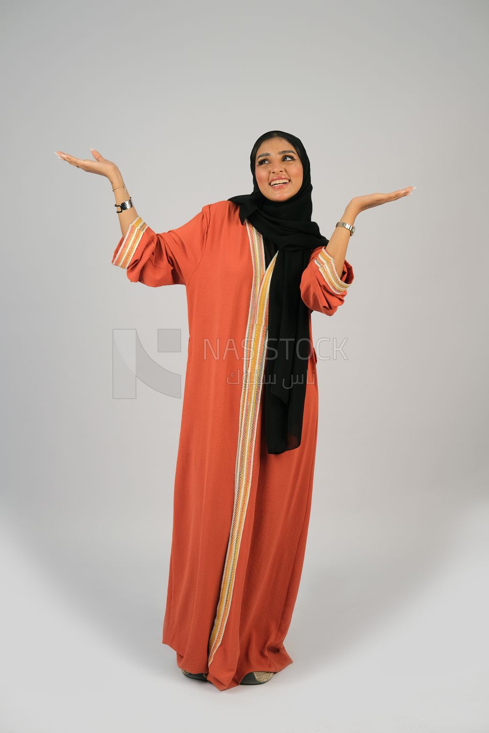 Gulf girl in colorful abaya and black hijab
