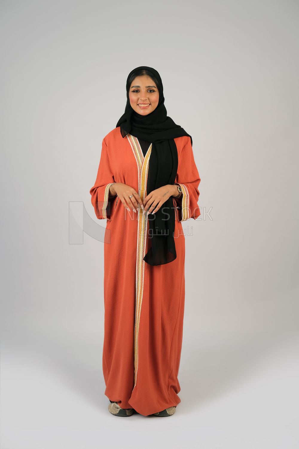 Gulf girl in colorful abaya and black hijab