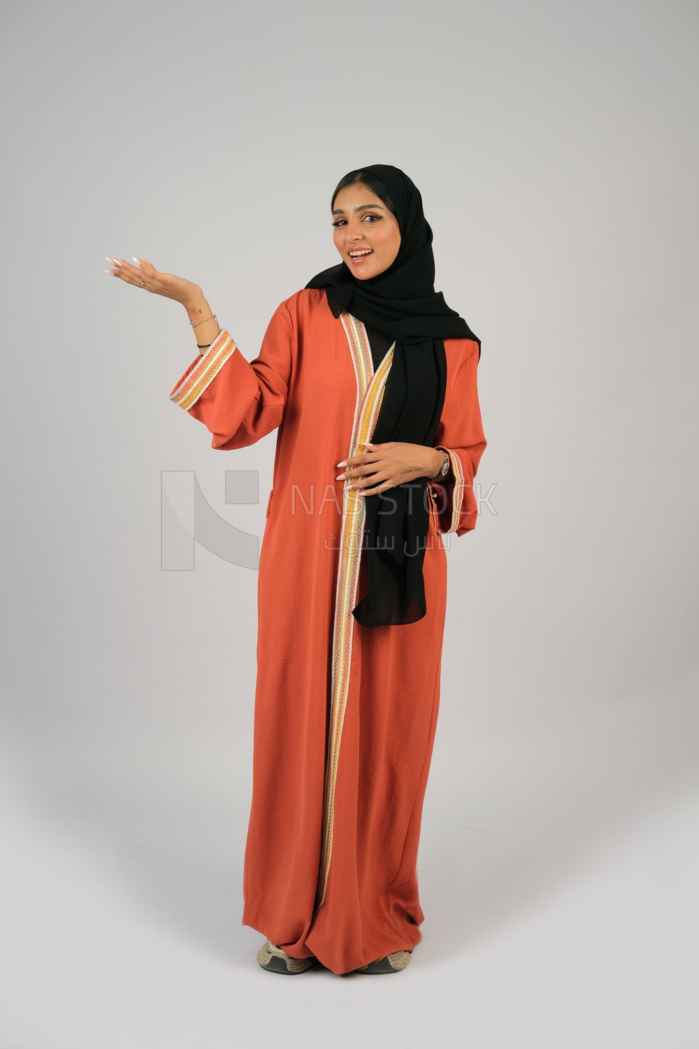 Gulf girl in colorful abaya and black hijab