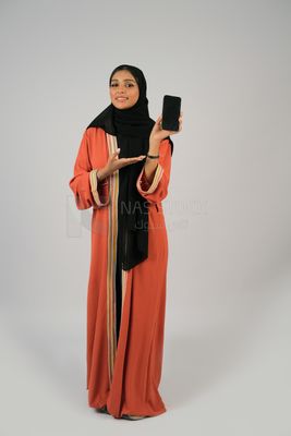 Gulf girl holding a phone with a blank black screen