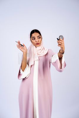 Saudi Gulf girl putting on makeup