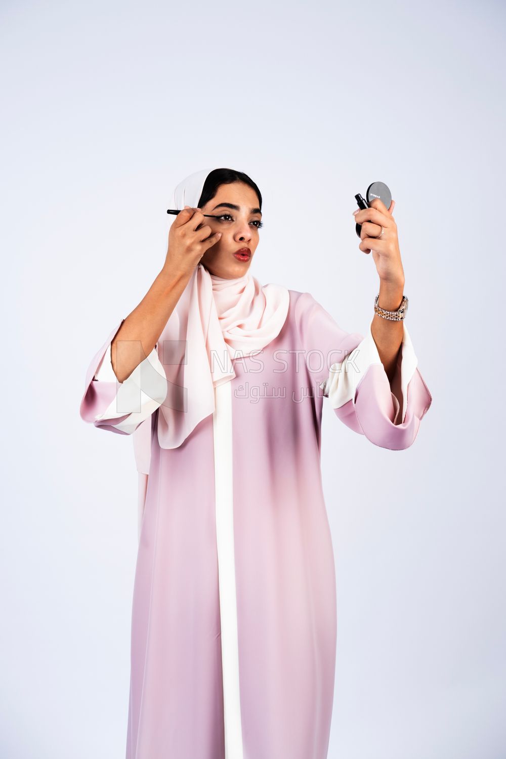 Saudi Gulf girl putting on makeup