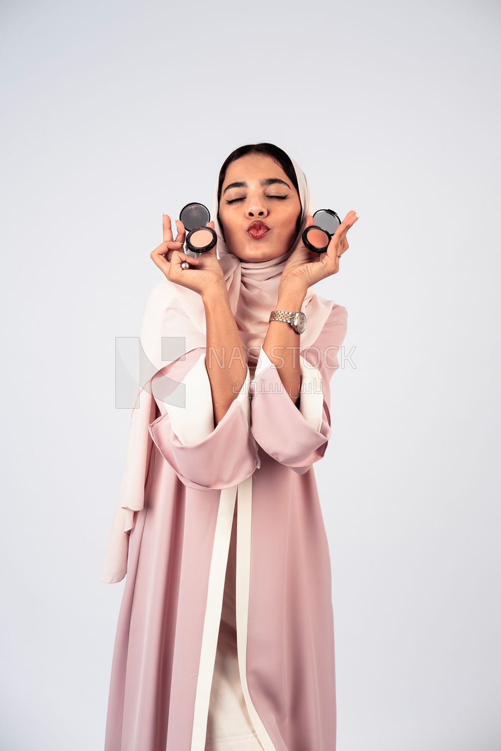 Saudi Gulf girl putting on makeup