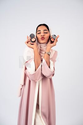 Saudi Gulf girl putting on makeup