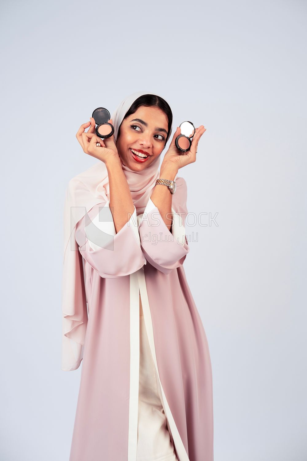 Saudi Gulf girl putting on makeup