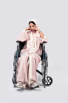 Girl sitting in wheelchair