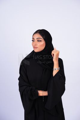 Gulf woman wearing black abaya and hijab