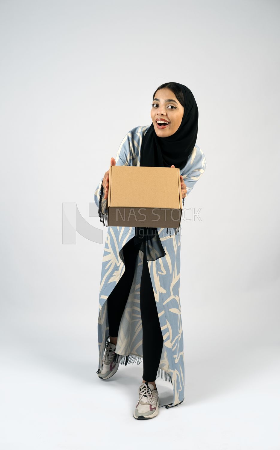 Gulf girl holding a special order box