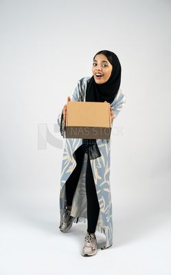 Gulf girl holding a special order box