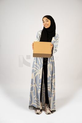 Gulf girl holding a special order box