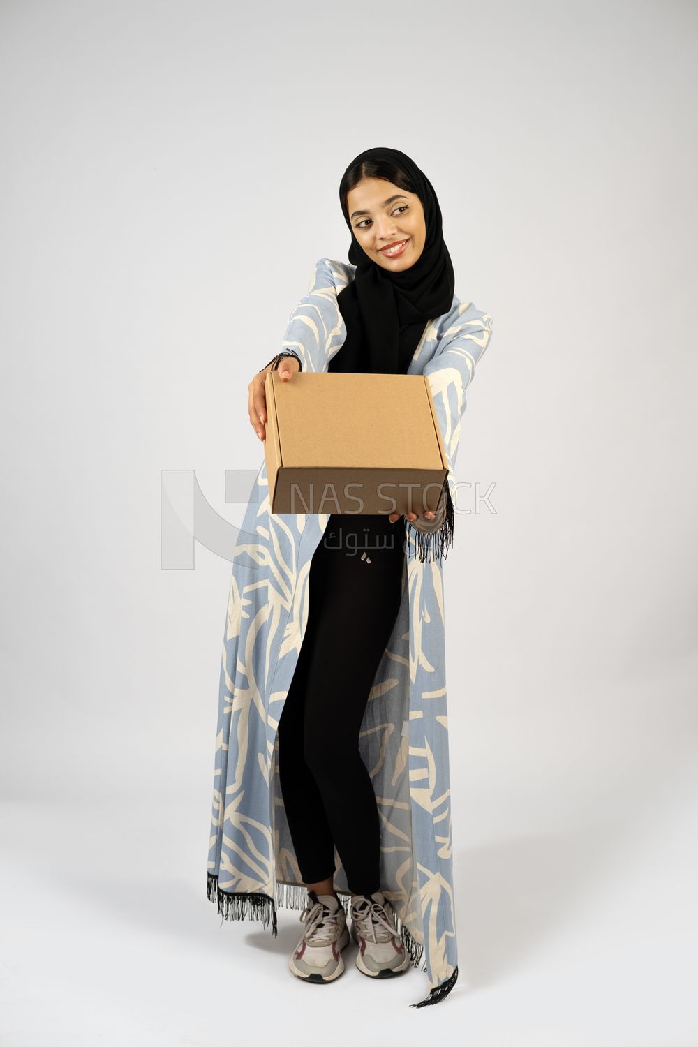 Gulf girl holding a special order box