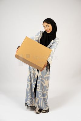 Gulf girl holding a special order box