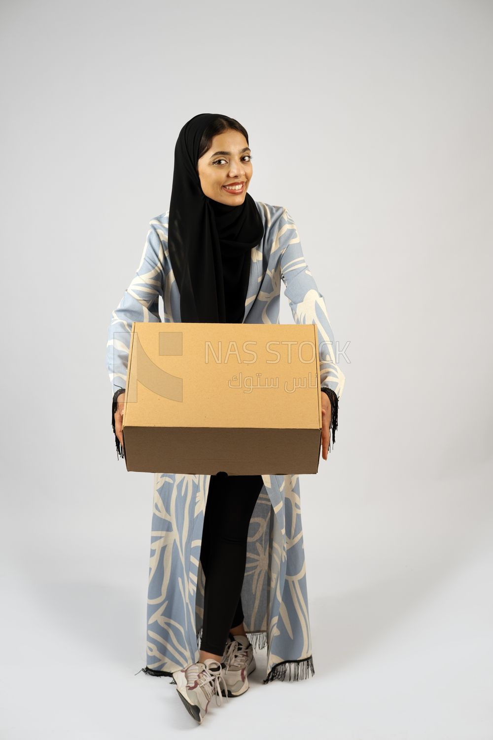 Gulf girl holding a special order box