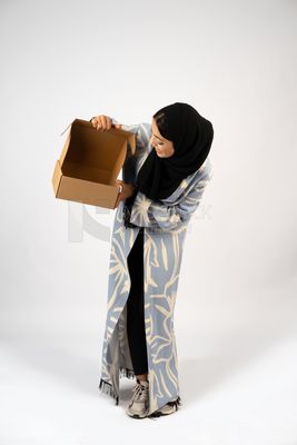 Gulf girl holding a special order box