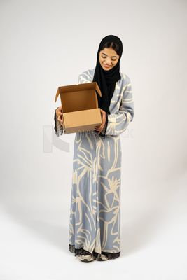 Gulf girl holding a special order box